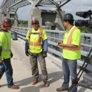 Director Jeff Dorn talks saftey vest fashions with Ironworkers.